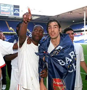 Lauren and Robert Pires (Arsenal) celebrate winning the league