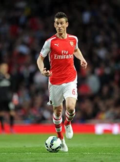 Images Dated 11th May 2015: Laurent Koscielny: In Action for Arsenal Against Swansea City, Premier League 2014/15