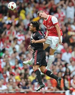Arsenal v AC Milan 2010-11 Collection: Laurent Koscielny (Arsenal) Borriello (Milan). Arsenal 1: 1 AC Milan. Emirates Cup