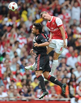 Arsenal v AC Milan 2010-11 Collection: Laurent Koscielny (Arsenal) Borriello (Milan). Arsenal 1: 1 AC Milan. Emirates Cup