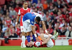Images Dated 2nd April 2011: Laurent Koscielny (Arsenal) lies injuered following a challenge from Steven N Zonzi