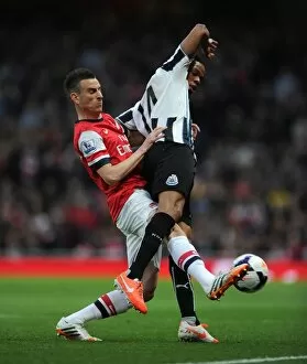 Images Dated 28th April 2014: Laurent Koscielny (Arsenal) Loic Remy (Newcastle). Arsenal 2: 0 Newcastle United