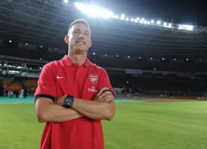 Indonesia Dream Team V Arsenal 2013-14 Prints: Laurent Koscielny: Arsenal Star Faces Indonesia All-Stars in 2013