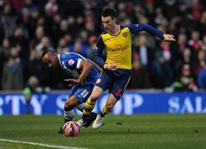 Images Dated 25th January 2015: Laurent Koscielny Battles Past Chris O'Grady: Arsenal vs. Brighton & Hove Albion, FA Cup 2015