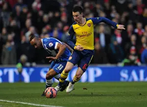 Brighton And Hove Albion V Arsenal - FA Cup 2014/15 Prints: Laurent Koscielny Battles Past Chris O'Grady: Arsenal vs