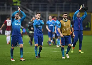 AC Milan V Arsenal 2017-18 Prints: Laurent Koscielny Celebrates with Arsenal Fans after AC Milan Clash in Europa League