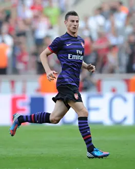 Cologne V Arsenal 2012-13 Prints: Laurent Koscielny Faces Off Against FC Cologne in 2012 Pre-Season Friendly