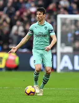 West Ham United V Arsenal 2018-19 Prints: Laurent Koscielny Focused Amidst the Action: West Ham United vs Arsenal FC