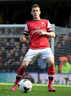 Images Dated 22nd March 2014: Laurent Koscielny Focused Amidst Chelsea vs Arsenal Rivalry (2013-14)