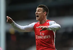 Tottenham Hotspur V Arsenal 2014-15 Prints: Laurent Koscielny Focused Amidst the Rivalry: Tottenham vs