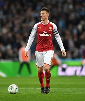 Images Dated 25th February 2018: Laurent Koscielny Focused at Arsenal vs Manchester City Carabao Cup Final
