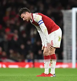 Arsenal V Chelsea - Carabao Cup 2017-18 Prints: Laurent Koscielny Focuses in Arsenal's Carabao Cup Battle Against Chelsea