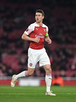 Images Dated 13th December 2018: Laurent Koscielny Focuses in Arsenal's Europa League Clash Against Qarabag