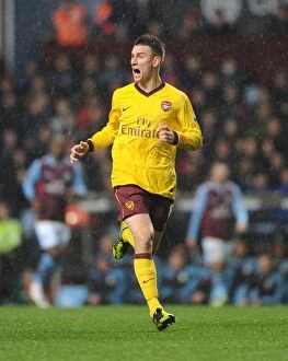 Images Dated 24th November 2012: Laurent Koscielny Focuses in Aston Villa vs. Arsenal Premier League Clash (2012-13)