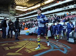 West Ham United V Arsenal 2014-15 Prints: Laurent Koscielny Gearing Up: Arsenal vs. West Ham United, Premier League (2014-15)