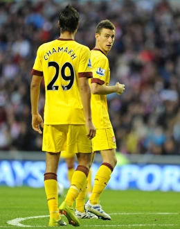 Koscielny Laurent Collection: Laurent Koscielny and Marouane Chamakh (Arsenal). Sunderland 1: 1 Arsenal