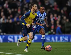 Brighton And Hove Albion V Arsenal - FA Cup 2014/15 Prints: Laurent Koscielny Outmuscles Chris O'Grady in FA Cup Clash: Brighton vs Arsenal