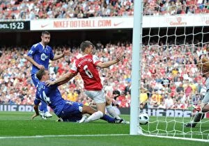 Arsenal v Bolton Wanderers 2010-11 Collection: Laurent Koscielny shoots past Bolton goalkeeper Adam Bogdan to score the 1st Arsenal goal