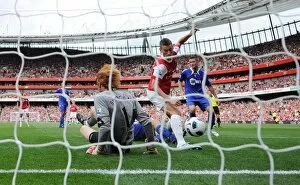 Koscielny Laurent Collection: Laurent Koscielny shoots past Bolton goalkeeper Adam Bogdan to score the 1st Arsenal goal