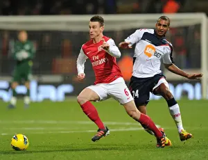 Bolton Wanderers V Arsenal 2011-12 Prints: Laurent Koscielny Surges Past David Ngog: Bolton Wanderers vs