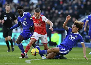 Leandro Trossard Clashes with Leicester's Faes and Ndidi in Arsenal's Premier League Battle