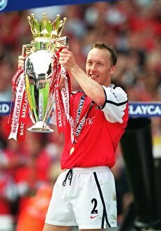 Images Dated 7th April 2005: Lee Dixon lifts the Premiership trophy after the match. Arsenal 4: 3 Everton, F