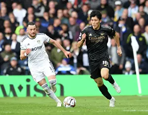Leeds United V Arsenal 2022-23 Prints: Leeds United vs. Arsenal: Intense Battle – Tomiyasu Under Pressure