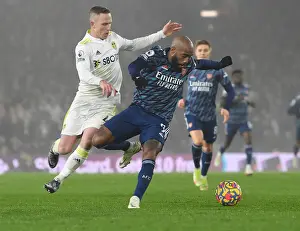 Leeds United vs. Arsenal: Lacazette Clashes with Forshaw in Premier League Showdown