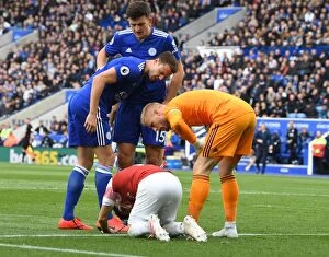 Leicester City v Arsenal 2018-19 Collection: Leicester vs Arsenal: Evans and Schmeichel Over Torreira's Injury (2018-19)