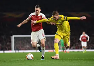 Arsenal V BATE Borisov 2018-19 Prints: Lichtsteiner vs Filipovic: A Europa League Battle at Arsenal's Emirates Stadium