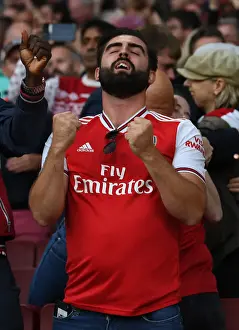Arsenal V Tottenham Hotspur 2021-22 Prints: London Derby: Arsenal vs. Tottenham - Passionate Arsenal Fan at Emirates Stadium