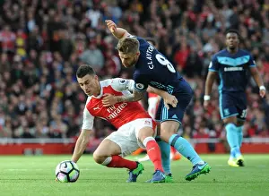 LONDON, ENGLAND - OCTOBER 22: Laurent Koscielny of Arsenal under pressure from Adam Clayton of Middlesbrough during