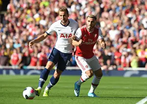 London Rivalry: Arsenal vs. Tottenham Clash in the Premier League - A Battle of Seasons Past: Kolasinac vs. Kane