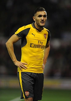 Nottingham Forest V Arsenal EPL Cup 3rd Round 2016-17 Prints: Lucas Perez in Action: Arsenal Overpowers Nottingham Forest in EFL Cup Third Round