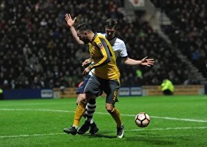 Images Dated 7th January 2017: Lucas Perez (Arsenal) back heels the ball for Olivier Guirouds goal under pressure