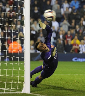 West Bromwich Albion V Arsenal 2013-14 - Capital Cup Prints: Lukas Fabianski in Penalty Shootout Drama: West Bromwich Albion vs