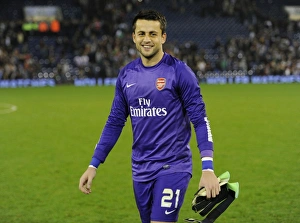 West Bromwich Albion V Arsenal 2013-14 - Capital Cup Prints: Lukas Fabianski Smiling Victory: Arsenal's Capital Cup Triumph at West Bromwich Albion (2013-14)