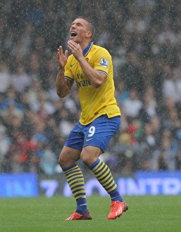 Fulham F C Prints: Lukas Podolski in Action: Fulham vs Arsenal, Premier League 2013-14