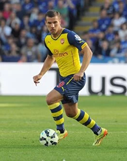 Images Dated 31st August 2014: Lukas Podolski in Action: Leicester City vs. Arsenal, Premier League 2014-15