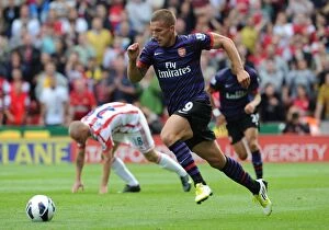 Images Dated 26th August 2012: Lukas Podolski in Action: Stoke City vs. Arsenal, Premier League 2012-13