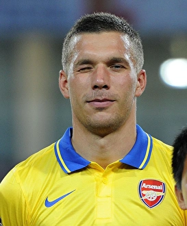 Vietnam V Arsenal 2013-14 Prints: Lukas Podolski in Action: Vietnam vs. Arsenal (2013-14)