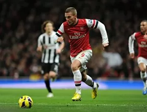 Arsenal v Newcastle United 2012-13 Collection: Lukas Podolski (Arsenal). Arsenal 7: 3 Newcastle United. Barclays Premier League. Emirates Stadium
