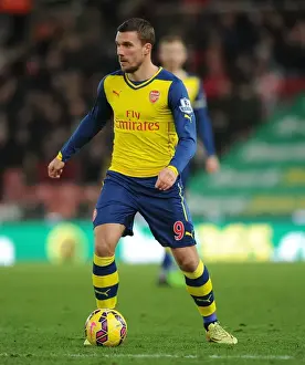 Stoke City V Arsenal 2014-15 Prints: Lukas Podolski: Arsenal's Star at Stoke City (2014-15)