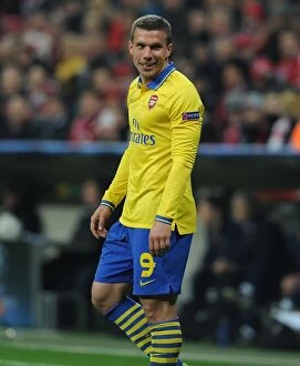 Images Dated 11th March 2014: Lukas Podolski: Battle in Munich - FC Bayern vs. Arsenal, UEFA Champions League 2014