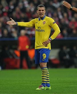 Images Dated 11th March 2014: Lukas Podolski: A Former Bayern Munich Star Faces His Old Team in the UEFA Champions League