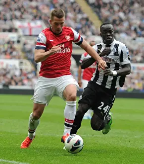 Newcastle United V Arsenal 2012-13 Prints: Lukas Podolski Breaks Past Cheik Tiote: Newcastle United vs