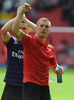 Lukas Podolski Celebrates with Arsenal Fans: Liverpool vs Arsenal, Premier League 2012-13