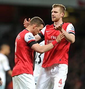 Arsenal v West Ham United 2013/14 Collection: Lukas Podolski celebrates scoring his and Arsenals 1st goal with Per Mertesacker