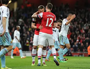 Arsenal V West Ham United 2013/14 Prints: Lukas Podolski celebrates scoring his and Arsenals 1st goal with Olivier Giroud