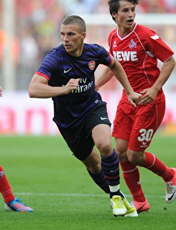 Cologne V Arsenal 2012-13 Prints: Lukas Podolski Clashes with Former Team: Cologne vs Arsenal, 2012-13 Pre-Season Friendly